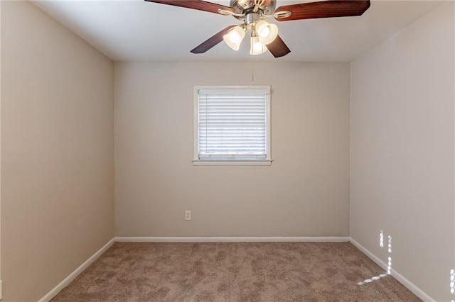 unfurnished room featuring ceiling fan and light carpet