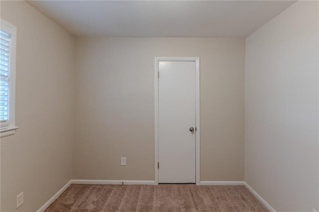 empty room featuring carpet floors