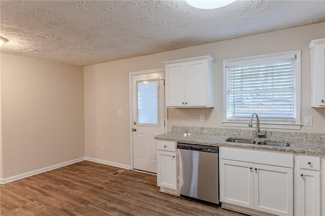 kitchen featuring sink, light stone counters, stainless steel dishwasher, hardwood / wood-style floors, and white cabinets