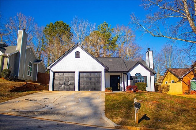 ranch-style home with a garage, a front lawn, driveway, and fence