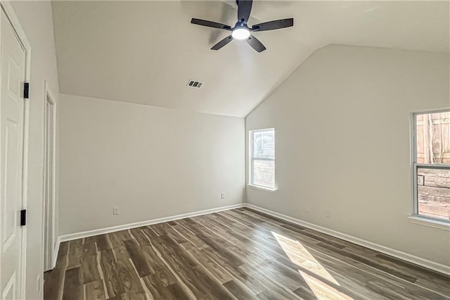 unfurnished room with visible vents, lofted ceiling, a healthy amount of sunlight, and a ceiling fan