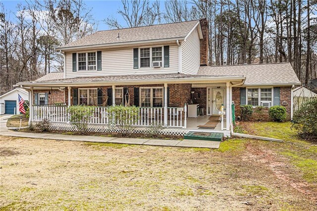 view of front of property with a front lawn and a porch