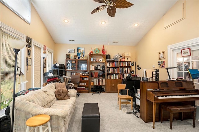 office with high vaulted ceiling, ceiling fan, and light colored carpet