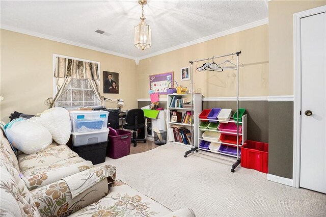 rec room featuring carpet flooring, a textured ceiling, and ornamental molding