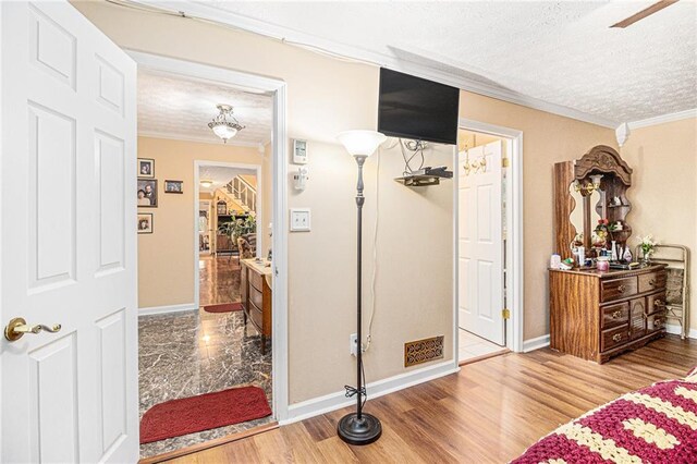 bathroom with tiled bath and crown molding