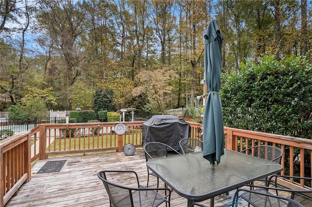 wooden deck featuring grilling area