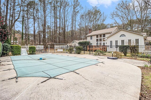 rear view of house with a lawn and a wooden deck