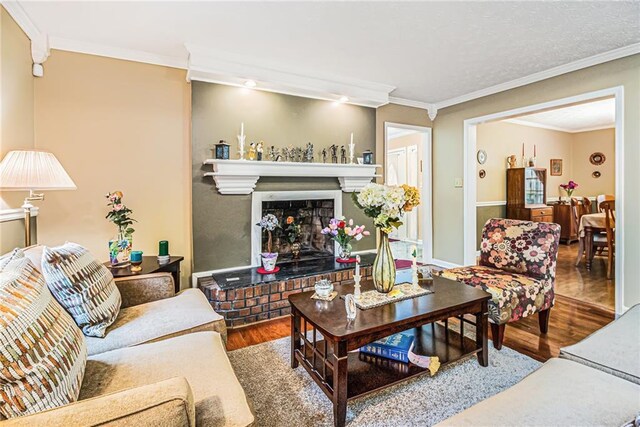 dining room with hardwood / wood-style floors, an inviting chandelier, crown molding, and a textured ceiling