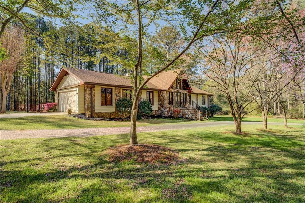460 Haynes Creek Cir, Oxford, GA 30054 - view of front of property featuring a front yard and an attached garage