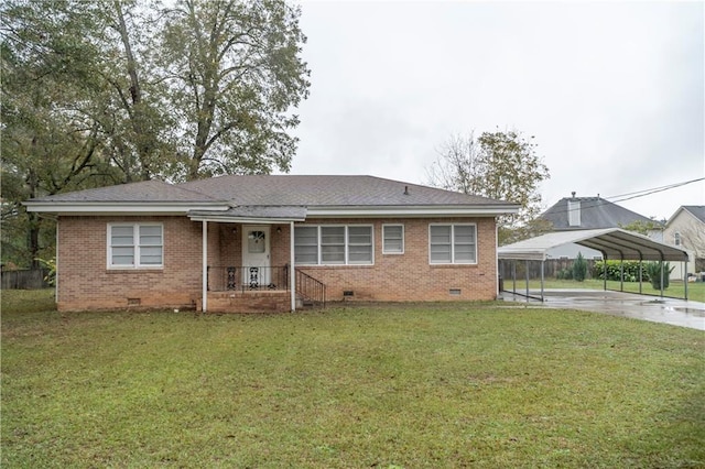 view of front facade featuring a front yard and a carport