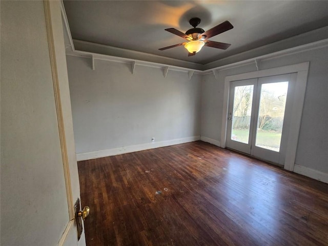 unfurnished room featuring ceiling fan and dark hardwood / wood-style flooring