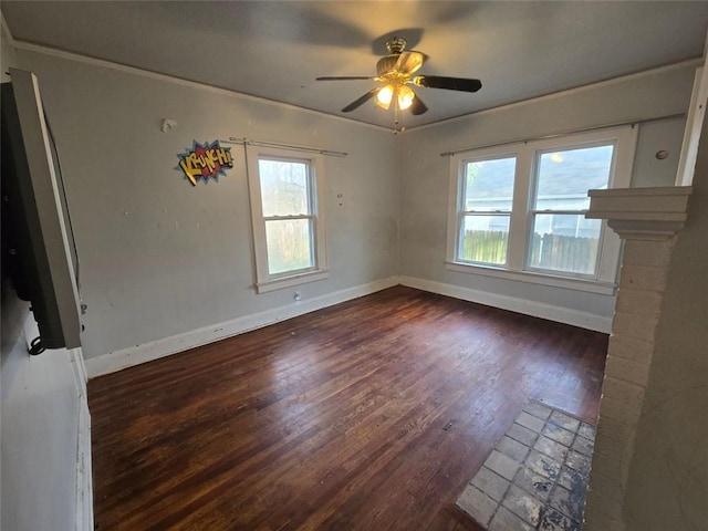 spare room featuring dark hardwood / wood-style flooring and ceiling fan