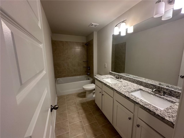 2180 Highridge Point Dr, Lithia Springs, GA 30122 - bathroom featuring double vanity, toilet, tile patterned flooring, and tub / shower combination