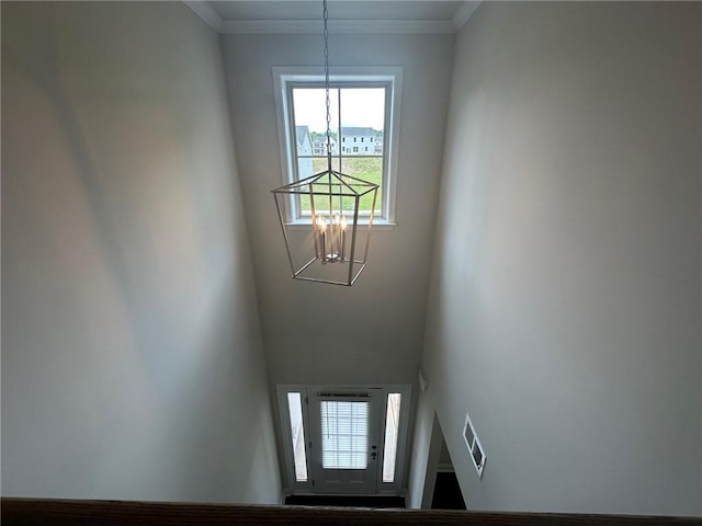 2180 Highridge Point Dr, Lithia Springs, GA 30122 - detailed view of a chandelier and crown molding