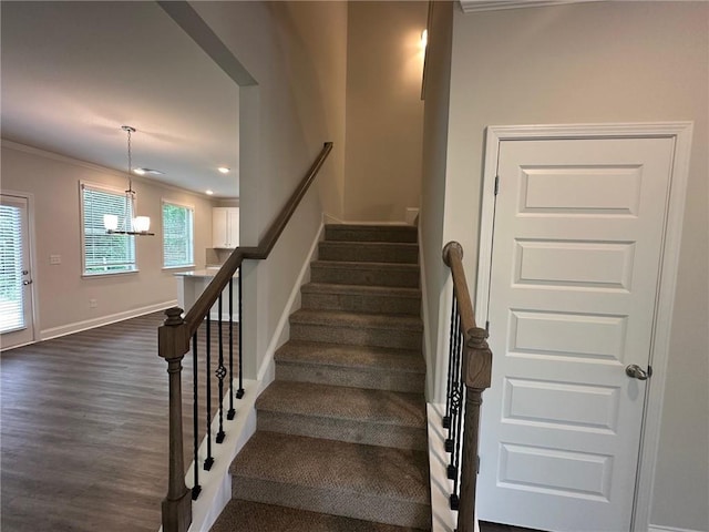 2180 Highridge Point Dr, Lithia Springs, GA 30122 - stairway featuring ornamental molding, a chandelier, wood finished floors, baseboards, and recessed lighting
