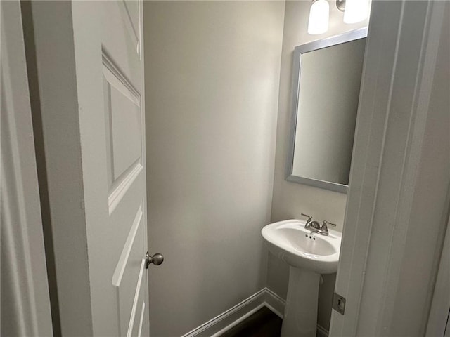 2180 Highridge Point Dr, Lithia Springs, GA 30122 - bathroom with a sink and baseboards