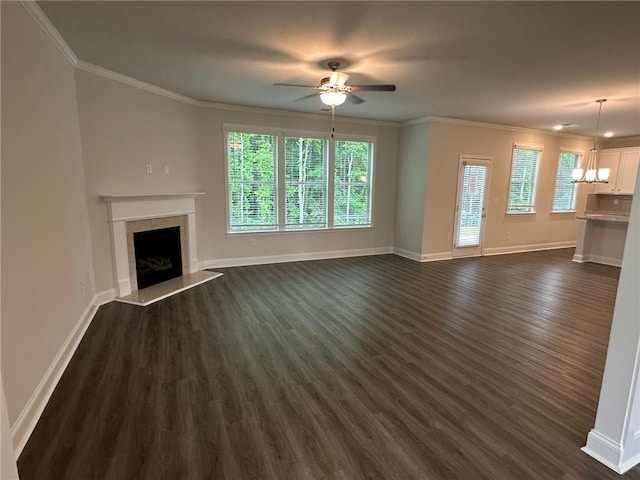 2180 Highridge Point Dr, Lithia Springs, GA 30122 - unfurnished living room with dark wood-style floors, ceiling fan, a fireplace, crown molding, and baseboards