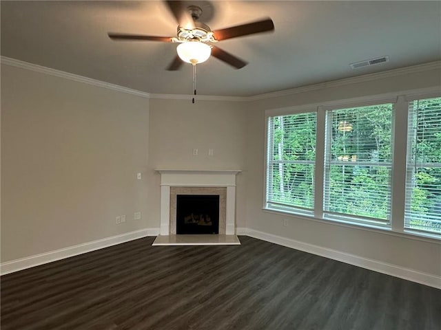 2180 Highridge Point Dr, Lithia Springs, GA 30122 - unfurnished living room with dark wood-type flooring, ceiling fan, a high end fireplace, baseboards, and crown molding