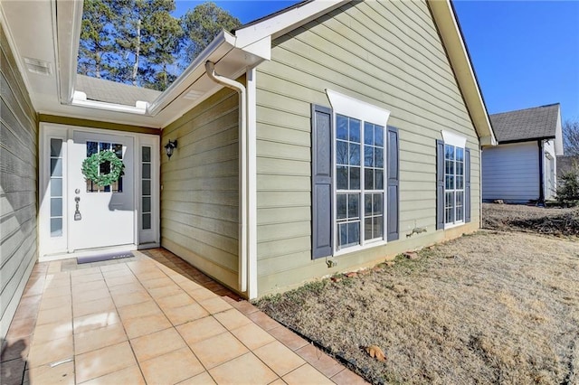 doorway to property featuring a patio area