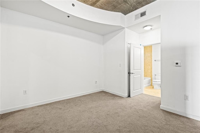 spare room with carpet flooring, an ornate ceiling, and baseboards