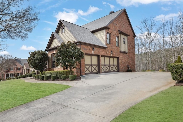 view of side of property featuring a yard, roof with shingles, concrete driveway, a garage, and brick siding