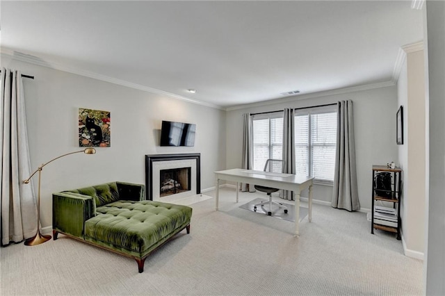 carpeted office space featuring a fireplace with flush hearth, visible vents, baseboards, and crown molding