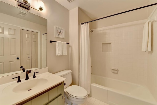 full bathroom featuring shower / bath combination with curtain, visible vents, toilet, vanity, and tile patterned floors