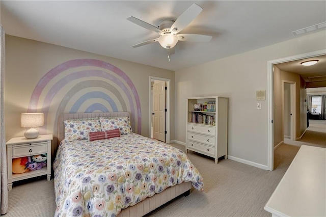 bedroom with light carpet, ceiling fan, visible vents, and baseboards