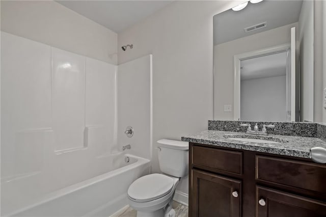 full bathroom with toilet, baseboards, visible vents, shower / tub combination, and vanity