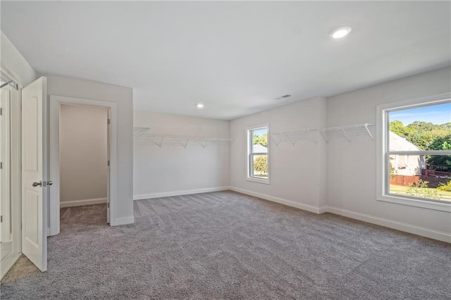 unfurnished bedroom with carpet flooring, baseboards, visible vents, and recessed lighting