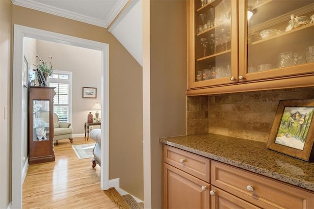 kitchen with visible vents, crown molding, under cabinet range hood, stainless steel appliances, and a sink