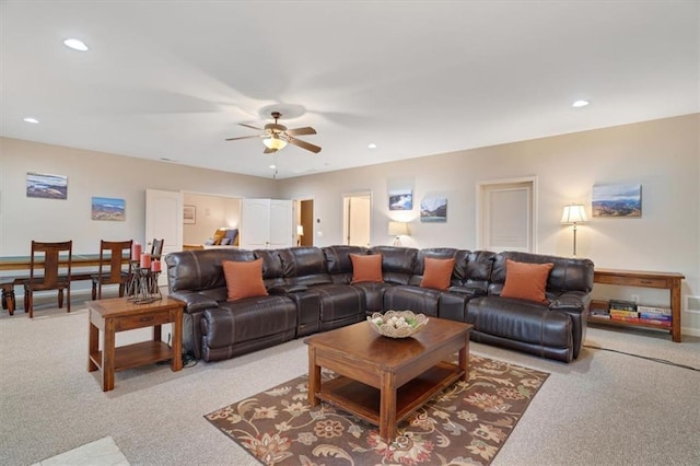 carpeted living area with a ceiling fan and recessed lighting