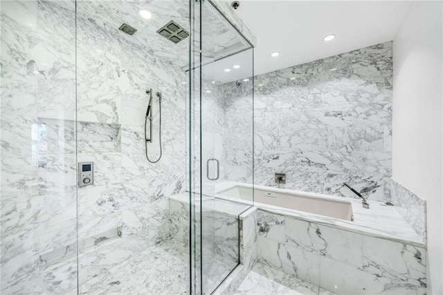 full bath with a garden tub, a marble finish shower, and recessed lighting