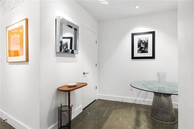 dining area featuring concrete flooring, recessed lighting, visible vents, and baseboards