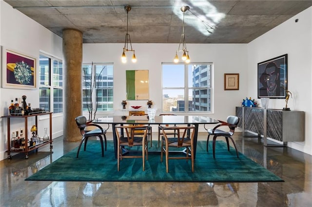 dining room featuring concrete flooring