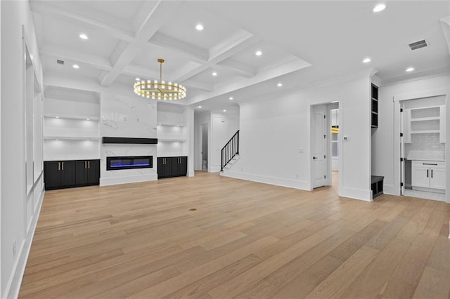 unfurnished living room with visible vents, stairway, baseboards, light wood-style floors, and recessed lighting