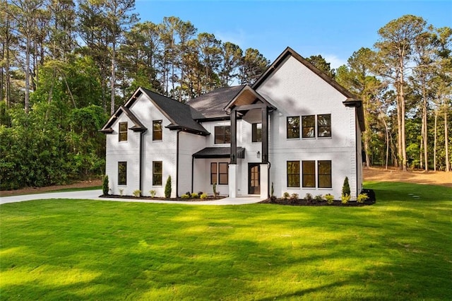 view of front of home featuring a front lawn and stucco siding
