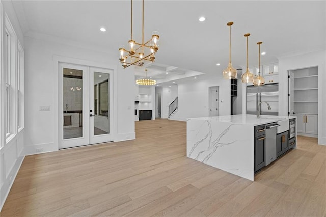 kitchen featuring crown molding, appliances with stainless steel finishes, recessed lighting, and light wood finished floors