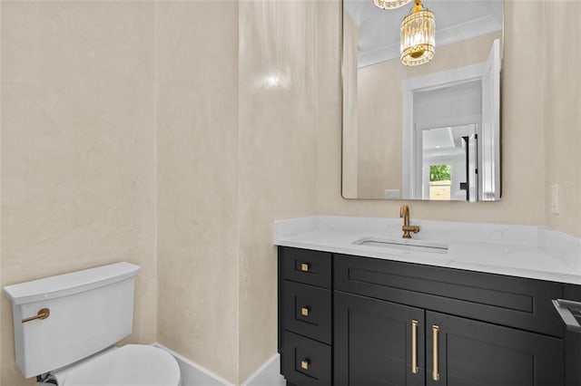 half bath featuring toilet and vanity