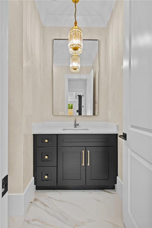 bathroom with baseboards, an inviting chandelier, marble finish floor, and vanity