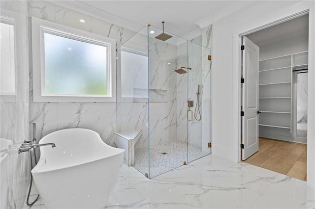 full bathroom featuring a marble finish shower, a soaking tub, and marble finish floor