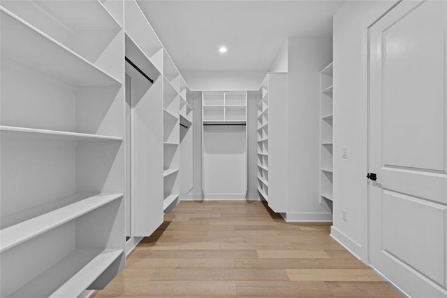spacious closet with wood finished floors