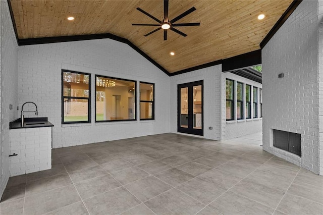 view of patio / terrace with ceiling fan, french doors, and area for grilling
