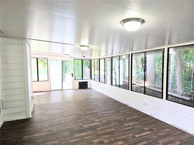 4093 Chapel Mill Bnd, Decatur, GA 30034 - unfurnished sunroom with a textured ceiling and wood finished floors