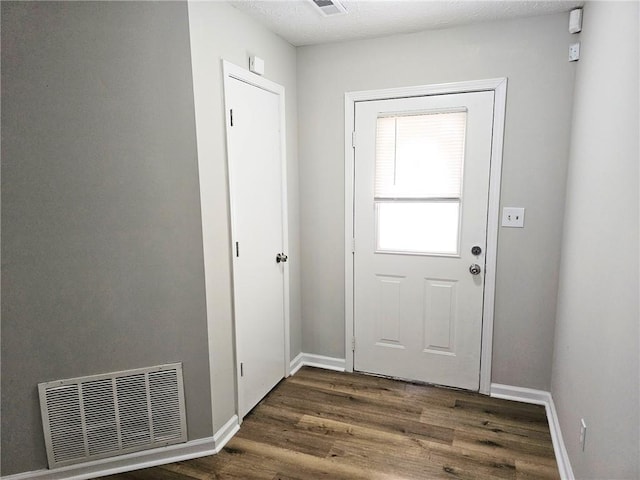4093 Chapel Mill Bnd, Decatur, GA 30034 - doorway to outside featuring wood finished floors, baseboards, and visible vents