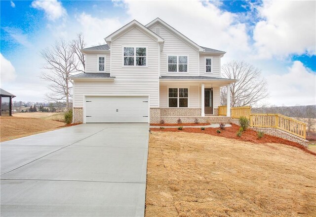 135 Applewood Way, Homer, GA 30547 - view of front of home with a garage, a porch, and a front yard