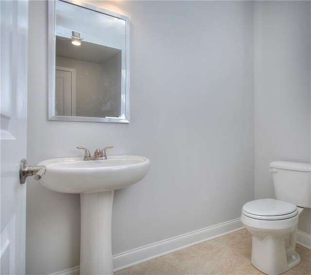 135 Applewood Way, Homer, GA 30547 - bathroom with sink, tile patterned floors, and toilet