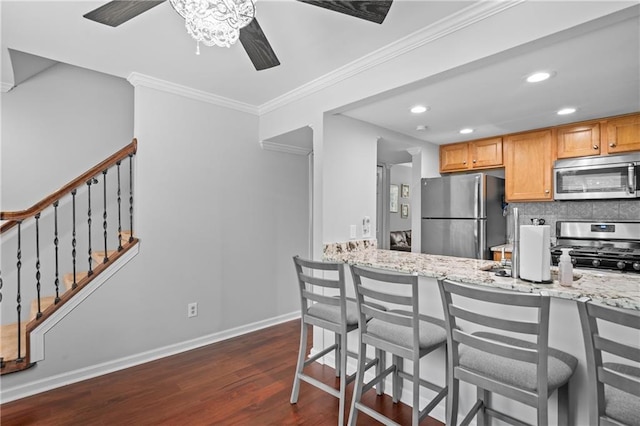 31 Country Place Ct, Alpharetta, GA 30005 - kitchen with stainless steel appliances, a ceiling fan, dark wood-style floors, crown molding, and backsplash