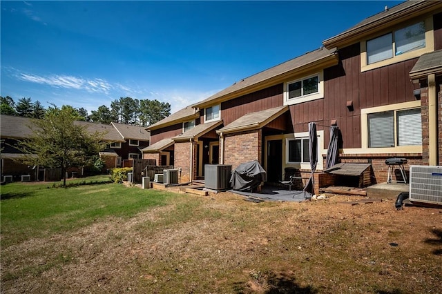 31 Country Place Ct, Alpharetta, GA 30005 - rear view of property featuring a patio area, a lawn, and brick siding