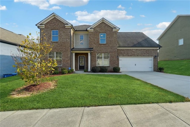 view of front of property featuring a garage and a front lawn